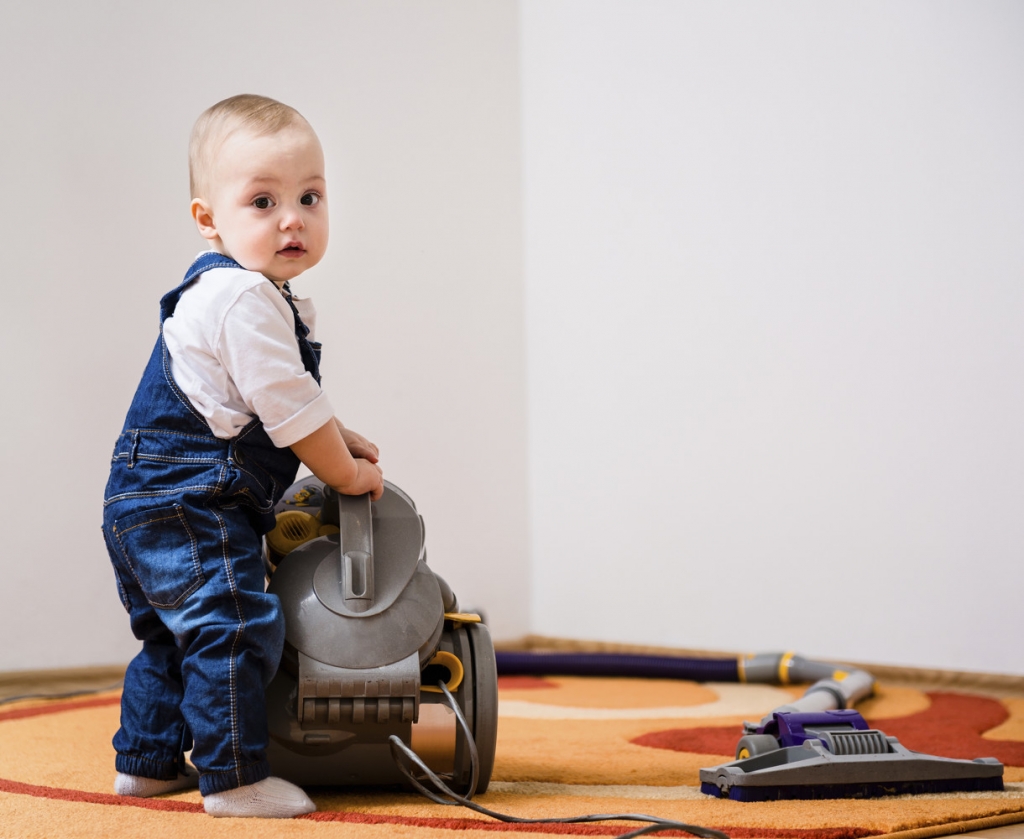 Baby cleaning carpet